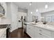 Bright kitchen with white cabinets, stainless steel appliances, and island with bar seating at 5726 Taylor Way, Sandy Springs, GA 30342