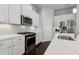 Updated kitchen with stainless appliances, white cabinets, and quartz countertops at 5726 Taylor Way, Sandy Springs, GA 30342