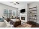 Cozy living room with a fireplace, comfortable seating, and bright natural light at 5726 Taylor Way, Sandy Springs, GA 30342