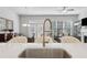 Open-concept living space with kitchen island overlooking the dining and living area at 5726 Taylor Way, Sandy Springs, GA 30342