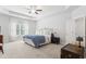 Spacious primary bedroom with a tray ceiling and ample natural light at 5726 Taylor Way, Sandy Springs, GA 30342