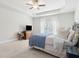 Inviting primary bedroom with a tray ceiling and a window at 5726 Taylor Way, Sandy Springs, GA 30342