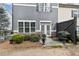Back patio featuring outdoor seating and a well-manicured garden at 5726 Taylor Way, Sandy Springs, GA 30342