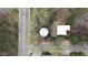Birds-eye view of modern home featuring geometric lines and a sleek design, surrounded by mature trees at 595 Overbrook Nw Dr, Atlanta, GA 30318