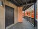Balcony with black railing and brick column at 595 Overbrook Nw Dr, Atlanta, GA 30318