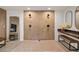Expansive bathroom with a dual shower, ample seating, and vanity mirroring a fireplace for a luxurious feel at 595 Overbrook Nw Dr, Atlanta, GA 30318