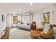 Open bedroom area featuring a four-poster bed, sitting area, and lots of natural light at 595 Overbrook Nw Dr, Atlanta, GA 30318