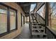 View of the exterior of a property with deck, stairs, and mature landscaping at 595 Overbrook Nw Dr, Atlanta, GA 30318