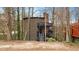 Three-story home with multi-level decks with brick chimney at 595 Overbrook Nw Dr, Atlanta, GA 30318