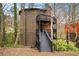 Three-story home with multi-level decks and brick chimney at 595 Overbrook Nw Dr, Atlanta, GA 30318