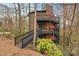 Exterior of home with multi-level decks and brick chimney at 595 Overbrook Nw Dr, Atlanta, GA 30318