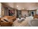 Well-lit living room with a comfortable seating arrangement, marble coffee table, and large windows with tree views at 595 Overbrook Nw Dr, Atlanta, GA 30318