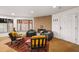 Bright living room with fireplace, wood floors, and lots of seating at 595 Overbrook Nw Dr, Atlanta, GA 30318