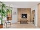 Cozy living room featuring a fireplace, a comfortable chair and large windows with natural light at 595 Overbrook Nw Dr, Atlanta, GA 30318