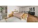 Main bedroom with a seating area, many windows, and hardwood floors at 595 Overbrook Nw Dr, Atlanta, GA 30318