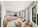 Bright main bedroom featuring large windows, a sitting area, and hardwood floors at 595 Overbrook Nw Dr, Atlanta, GA 30318