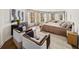 Spacious main bedroom featuring a sitting area, multiple windows, and a neutral color palette at 595 Overbrook Nw Dr, Atlanta, GA 30318