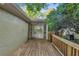 Backyard features spacious deck area leading to a screened-in porch, great for entertaining at 656 Channing Nw Dr, Atlanta, GA 30318