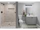 Stylish bathroom featuring a walk-in shower with marble-like tile and a modern vanity at 656 Channing Nw Dr, Atlanta, GA 30318
