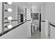 Unique bathroom with black and white mosaic tile floors, and an eye-catching vanity mirror at 656 Channing Nw Dr, Atlanta, GA 30318