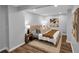 Serene bedroom features hardwood floors, neutral walls, and contemporary decor for a relaxing ambiance at 656 Channing Nw Dr, Atlanta, GA 30318