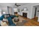 Inviting living room with a fireplace, hardwood floors, comfortable seating, and access to dining area at 656 Channing Nw Dr, Atlanta, GA 30318