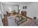 Cozy living room with hardwood floors, neutral walls, area rug, and comfortable seating arrangement at 656 Channing Nw Dr, Atlanta, GA 30318