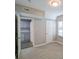 Bedroom view with wood-look floors, neutral paint, and adjoining kitchenette and bathroom for convenience at 1672 Thornton Pl, Atlanta, GA 30315