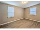 Comfortable bedroom with natural light, updated flooring, and neutral walls for a serene ambiance at 1672 Thornton Pl, Atlanta, GA 30315
