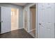 Hallway view with hardwood flooring, leading to a bathroom, creating a clean and connected space at 1672 Thornton Pl, Atlanta, GA 30315