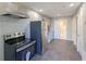 Bright kitchen with stainless steel appliances, ample cabinet space, and wood-look flooring at 1672 Thornton Pl, Atlanta, GA 30315
