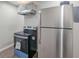 Close-up showcasing stainless steel refrigerator and modern electric range, highlighting kitchen appliances at 1672 Thornton Pl, Atlanta, GA 30315