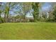 The image shows a large, grassy backyard with a wooden fence at 2792 Toney Dr, Decatur, GA 30032