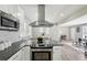Contemporary kitchen featuring granite counters, stainless appliances, and an open floor plan at 2792 Toney Dr, Decatur, GA 30032