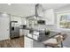 Modern kitchen features stainless steel appliances, granite countertops, and a breakfast bar with seating at 2792 Toney Dr, Decatur, GA 30032