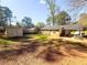 Spacious backyard with ample room for outdoor activities, storage shed, and covered patio at 2985 Catalina Dr, Decatur, GA 30032