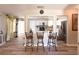 Open-concept kitchen with stainless steel appliances, bar seating, and ample counter space at 2985 Catalina Dr, Decatur, GA 30032