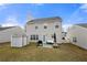 Cozy backyard featuring a small patio and storage shed at 331 Greystone Pkwy, Hiram, GA 30141