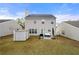 A backyard with a patio featuring an outdoor rug, umbrella and outdoor seating at 331 Greystone Pkwy, Hiram, GA 30141