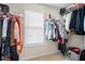 Walk-in closet features a window and is filled with an array of clothing items on racks at 331 Greystone Pkwy, Hiram, GA 30141