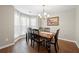 Elegant dining room with hardwood floors, chandelier, and large windows at 331 Greystone Pkwy, Hiram, GA 30141