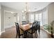 Elegant dining room featuring hardwood floors, chandelier, and bay window at 331 Greystone Pkwy, Hiram, GA 30141