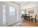 Inviting entryway with decorative glass door, hardwood floors, and dining room view at 331 Greystone Pkwy, Hiram, GA 30141