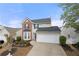 Charming home exterior featuring a two-car garage and well-maintained landscaping at 331 Greystone Pkwy, Hiram, GA 30141
