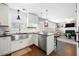 Stylish kitchen with stainless steel appliances and white cabinets open to the living room at 331 Greystone Pkwy, Hiram, GA 30141