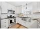 Stylish kitchen with stainless steel appliances and white cabinets with a view of the sink at 331 Greystone Pkwy, Hiram, GA 30141