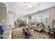 Open-concept living room showcasing hardwood floors, and a view to kitchen at 331 Greystone Pkwy, Hiram, GA 30141