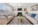 Bright living room featuring a fireplace, ceiling fan, and large window at 331 Greystone Pkwy, Hiram, GA 30141
