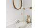 Bathroom featuring a decorative mirror, stylish fixtures, and clean design at 6700 Roswell Rd # 14C, Atlanta, GA 30328