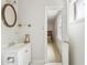 Bathroom with decorative mirror, updated fixtures, and access to additional rooms at 6700 Roswell Rd # 14C, Atlanta, GA 30328